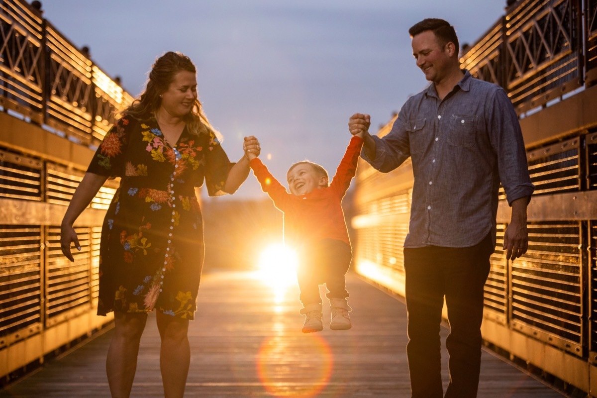 Family walking at sunset